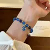 Pulsera de lapislázuli y arenisca azul para mujer, con un diseño único y elegante con un colgante de luna y planeta, que irradia un aura sofisticada y lujosa