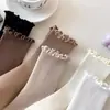 Calcetines de mujer dulces de madera con orejas, color liso blanco y negro, calcetines de pila, calcetines japoneses lindos de longitud media, estilo colegial jk con encaje, venta al por mayor