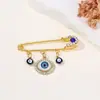 Broche de Borla Olho de Diabo Cravejado de Diamantes Criativo Europeu e Americano, Broche de Estilo Frio para Suéter de Cintura com Olhos Azuis de Alta Qualidade