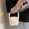 Mini Bolso de Color Sólido Estilo Coreano para Mujer 2026 Primavera Nueva Moda Elegante Bolso Silla de Montar Ligero Versátil Bolso para Auriculares