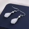 Pendientes antiguos retro de alta gama con orquídea y magnolia. Pendientes Hanfu de estilo chino con cara de caballo para mujer. Diseño elegante.