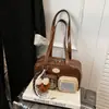 Moda Transfronteiriça Simples Versátil Bolsa de Bowling 2025 Novo Estilo Inverno Estilo Universitário Bolsa Feminina Fofa Bolsa de Ombro