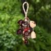 Campanilla de viento de cáscara de fruta de Yunnan producto terminado, colgante de bolsa de estilo artístico vintage DIY original, adorno de campanilla de mano de cáscara de fruta al por mayor