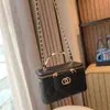 Bolso de Mano Caja de Metal con Asa Transfronteriza para Moda Bolsita de Maquillaje para Mujer 2026 Nuevo Estilo Bolso Pequeño Cruzado al Hombro con Cadena de Piel de Oveja