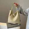 Bolso informal de gran capacidad para mujer, bolso de hombro de moda de verano, bolso de lona sencillo y combinable, bolso escolar para estudiantes universitarios.