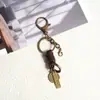 Accesorios para llaveros hechos a mano de fábrica, cierre de langosta, cuerda de cuero versátil retro, llavero semiacabado para colgar DIY