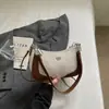 Bolso de axila de alta costura de nicho Shuai Mi Jia para mujer, nuevo bolso cruzado elegante de verano 2026, bolso de mano pequeño chic para salir
