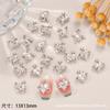 Nuevos Accesorios para Decoración de Uñas: Cristales para Uñas de Aleación con Pedrería en Forma de Corazón Torcido de la Reina Madre al por Mayor, Decoraciones Metálicas Huecas Incrustadas con Pedrería