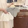 Estilo Coreano Niña 2026 Verano Nuevo Dulce y Elegante Vestido de Punto Hueco de Manga Corta con Lazo y Botón de Flor Conjunto de Dos Piezas
