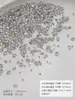 Flor blanca brillante de cristal de cinco pétalos con pedrería, paquete mayorista de material de decoración de uñas plano con pedrería de lujo ligero