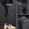 Jeans de Hombre de Primavera Hombres Venta al por Mayor Nuevos Rectos Sueltos Elásticos de Marca de Moda Adelgazantes Retro Americano Pantalones Largos Verano