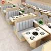 Sofá de cabina personalizado para casa de té comercial, cafetería, restaurante occidental, hot pot, restaurante de comida japonesa, mesa y sillas de mimbre tejido de madera maciza montadas en la pared