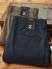 Pantalones largos de mezcla de algodón peinado de alta gama, engrosados y cepillados, nuevos para 2026, otoño/invierno, casual de negocios, corte holgado, pierna recta para hombre