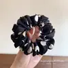 Goma para el pelo de lunares blancos y negros grande estilo intestino francés para mujer, accesorio para el pelo de tela versátil y simple de alta gama