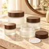 Botella de Vidrio con Grano de Madera Negra al por Mayor Botella Dispensadora de Cosméticos Botella para Crema de Mascarilla Esmerilada Botella para Crema de Ojos