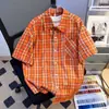 Camisa de rayas arrugadas de lujo ligero estilo coreano para hombre, camisa texturizada de manga corta holgada, camisa para ir al trabajo, naranja