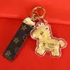 Fique Rico Imediatamente Chaveiro de Ouro Desenho Animado Zodíaco Chave de Carro Pingente Dourado Casal Ornamento Fofo Venda por Atacado de Fábrica