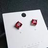 Brincos de tourmalina vermelha sintética com quatro garras para atacado de joias transfronteiriças Brincos de cristal roxo e amarelo europeus e americanos Brincos de safira real