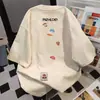 Nuevo diseño estilo americano lindo y divertido camiseta de manga corta color albaricoque para mujer, verano algodón puro holgada casual nicho top