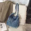 Bolsa mochila tote multiuso, bolsa de ombro transversal casual de nicho de grande capacidade para mulheres, bolsa feminina de brim lavado bordada
