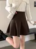 Falda de pana estilo coreano de cintura alta, adelgazante, para mujer, nueva colección otoño/invierno 2026, falda de línea A con diseño anti-exposición, adecuada para figuras petite, estilo falda de paraguas