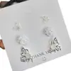 Pendientes de botón Retro Franceses de Rosa y Mariposa para Mujer Simples Elegantes de Gama Alta Dulces de Diseño de Nicho Modernos