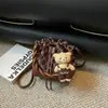 Nova bolsa balde retrô de nicho para mulheres 2026, bolsa sacola versátil de cordão de alta qualidade, bolsa de ombro e transversal super moderna