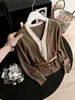 Cardigan de Cashmere Duas Peças Outono/Inverno 2026 Suéter Fino Feminino Color Block Malha Versátil para Usar por Cima