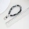 Lujo Ligero Cuentas de Tinta Blanco y Negro Cadena Corta para Teléfono Móvil Funda para Auriculares Colgante para Llave de Coche Cuerda de Muñeca Colorida Cadena de Mano con Cuentas