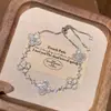 Pulseira de diamante flor de quatro folhas rosa para mulheres, design de nicho de luxo leve, pulseira ajustável de ouro rosa de alta qualidade