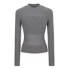 Top de punto hueco semitransparente negro con patchwork para mujer, otoño e invierno, camisa base sexy que ciñe la cintura, top corto ajustado con un diseño elegante