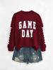 Camisa Estampada Elegante Europea y Americana de Manga Larga Día de Juego Nueva Moda Cuello Redondo Estampado en el Brazo Sudadera para Mujer 2025