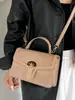 Bolso pequeño de mano de alta gama transfronterizo para mujer, nuevo diseño de moda, pequeño bolso cuadrado de lujo ligero, versátil para ir al trabajo, de un solo hombro, cruzado, moderno