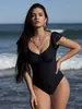 Traje de baño de una pieza con volantes de color sólido y estilo simple, moda transfronteriza de comercio exterior europeo y americano, traje de baño adelgazante para vacaciones en la playa para mujer