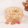 Venta Caliente Transfronteriza Estilo Bohemio Flor Ojo Mariposa Colgante Pulsera Multicapa Cuerda Elástica Pulsera de Perlas