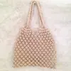 Venta al por mayor de fabricantes de Bolsas tejidas de paja, Bolsas de cuerda de algodón de estilo nuevo para vacaciones, Bolsos de mano tejidos para mujer, Bolsos de hombro de malla hueca sin forro
