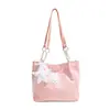 A bolsa tote doce popular deste ano para mulheres é o novo modelo de outono de 2026 com enfeites de estrela, adequada para o trabalho e como bolsa de ombro.