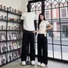 Moda Nueva Tendencia Estilo Nacional Marca de Moda Pareja Retro Americano Curvado Botones Largos Pantalones Vaqueros Sueltos Largos