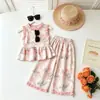 Nuevo Estilo Lindo Conjunto de Tirantes Florales sin Mangas para Niñas, Elegante Conjunto de Pantalones de Pierna Ancha, Ropa Infantil al por Mayor para Salidas a la Playa