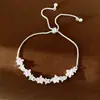 Pulseira colorida de estrela com zircônia incrustada, toque de luxo leve e nicho de alta qualidade, estilo fresco e doce, joia de mão elegante para atacado