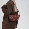 Bolsa Feminina com Rebites Transfronteiriça Estilo Punk Moderno Bolsa Dumpling Nova Primavera 2026 Bolsa de Ombro Bolsa Transversal Spicy Girl para Mulheres
