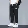 Calças harém masculinas de primavera e outono transfronteiriças, jeans, corte solto, novo estilo verão 2026, calças casuais estilo workwear com punho