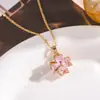 Collar de trébol de la suerte giratorio de diamantes completos transfronterizo para mujer, cadena para la clavícula de acero de titanio con incrustaciones de circón de color de alta calidad