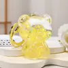 Colgante acrílico relleno de aceite, llavero luminoso con forma de taza de iceberg, colgante para coche, botella con forma de arena movediza, accesorio para mochila escolar.