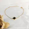 Pulsera de trébol de cuatro hojas transfronteriza para mujer, joyería de cuerda para la mano, accesorios, pulsera, adorno para la mano, accesorio de mano de alta gama de lujo ligero europeo y americano