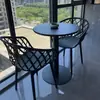 Juego pequeño de mesa y sillas redondas de acero al carbono simple para ocio en balcón, mesa de discusión, área de descanso, mesa de comedor para cafetería de té con leche al aire libre