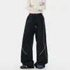 Calça de perna larga desconstruída com costura contrastante verde militar para homens e mulheres, cintura elástica, fita de tecido em cor contrastante, estilo outdoor, calça casual fluida