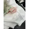 Recomendação PrincipalColeção Nova Yuran 26 Início da Primavera: Camisa Longa Oversized com Estampa de Selo Vintage em Tecido de Algodão e Linho de Algodão