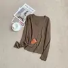 Camiseta básica de manga larga con cuello en V y abertura frontal, color liso, camiseta interior simple para mujer, nuevo top casual de otoño/invierno 2026, moderno