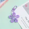 Novo Chaveiro de Flor Colorido Vazado Transparente Pingente de Joia DIY Versátil Criativo Charme para Bolsa Feminina